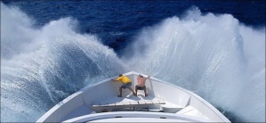 BLOW-YOUR-MIND-guys-at-front-of-boat-grasp-in-front-of-wave